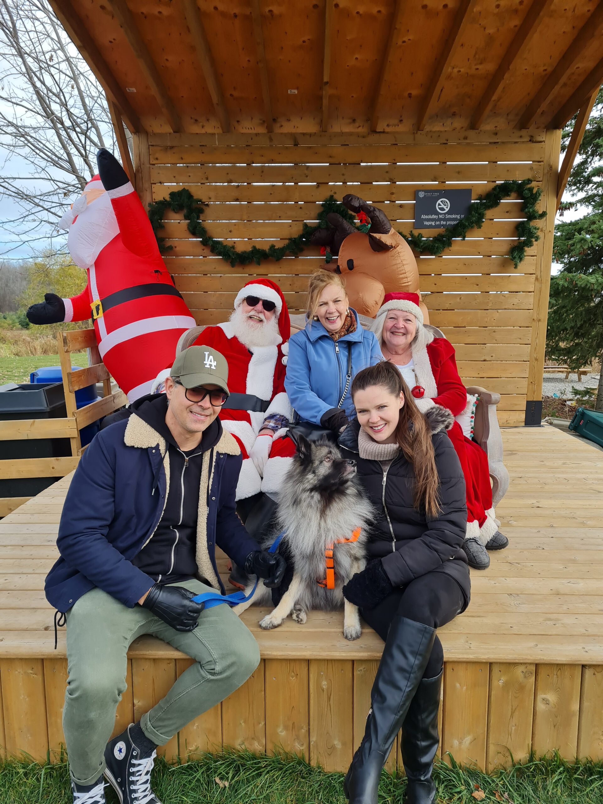 A family taking a picture with Santa at Spirit Tree